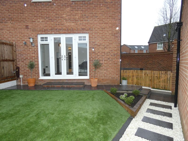Rear garden/Patio area- click for photo gallery